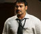 Ajay Devgan in white shirt and blue tie