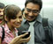 Shraddha Das and Ajay Devgan looking happy by watching in mobile